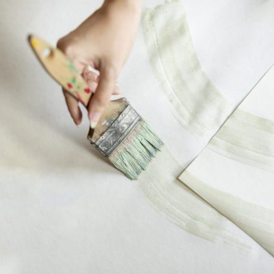 flat-lay-woman-painting-floor